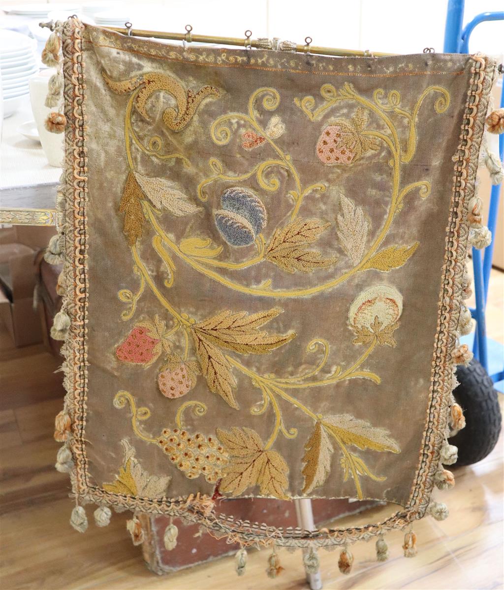 A Victorian tapestry banner face screen, with brass adjustable bracket and clamp